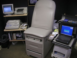 The area in which a patient would get a nerve test with equipment around a patient chair
